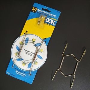 (2) 5" to 7" Gold Tone Plate Wall Hangers (1 NIB & 1 Used without Wall hook)